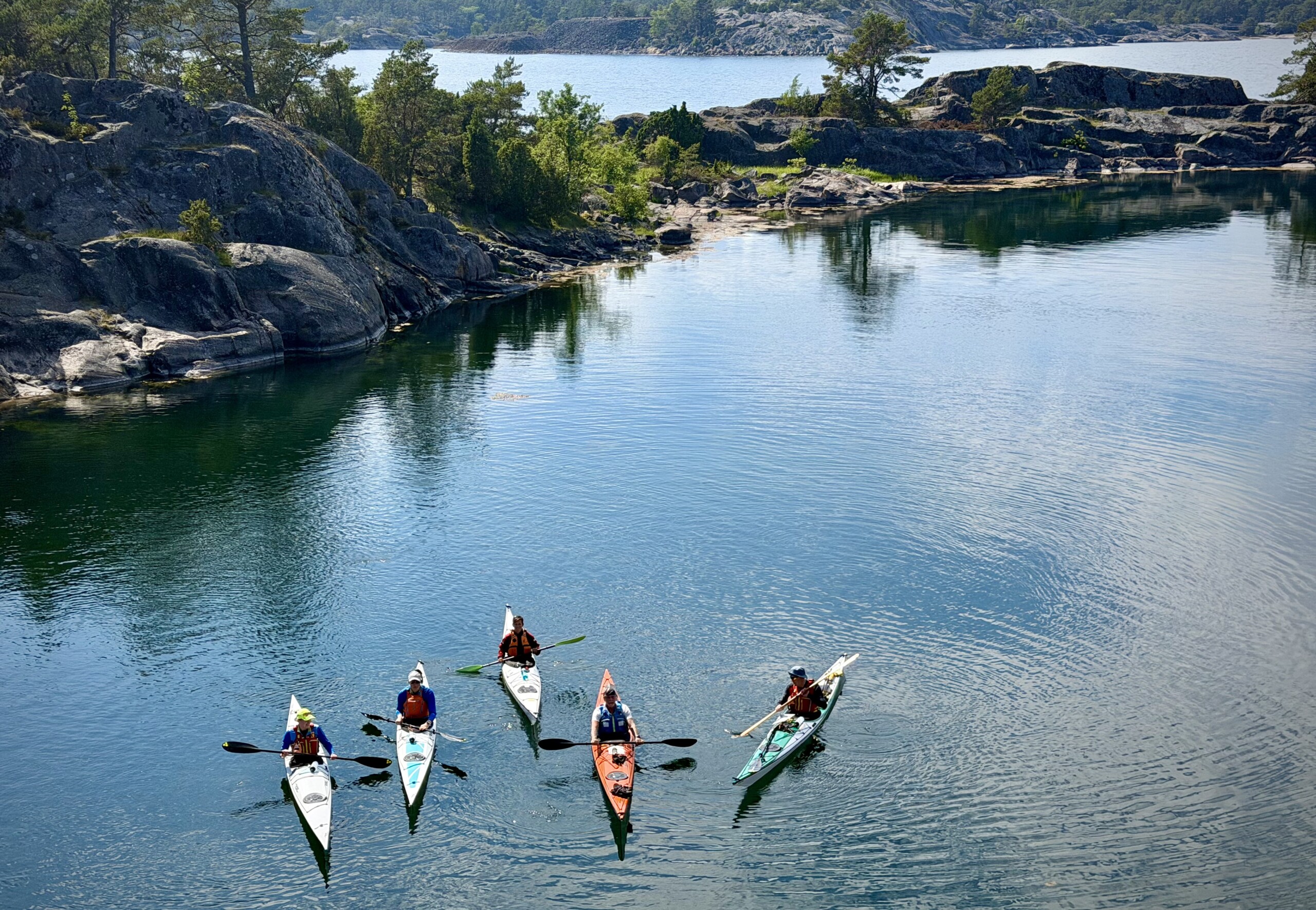 five paddlers on the water